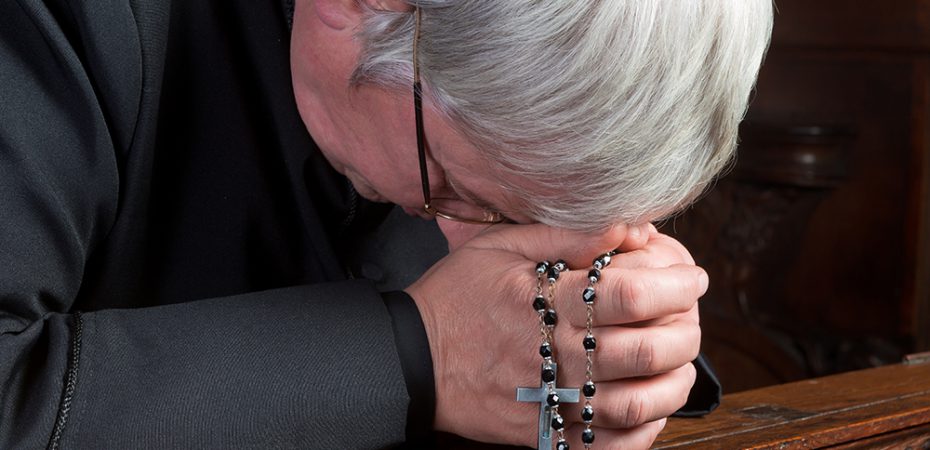 Priest praying