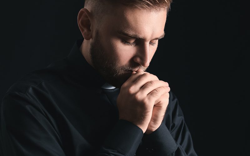 priest prays