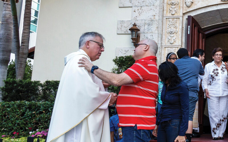 greeting parishioners