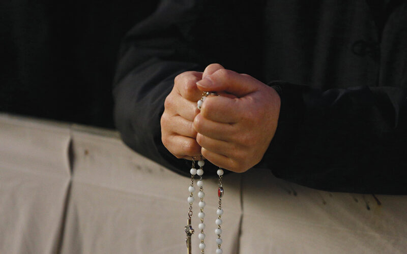 priest prays