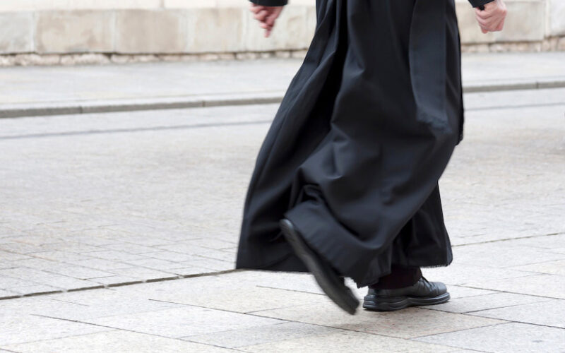 priest walking