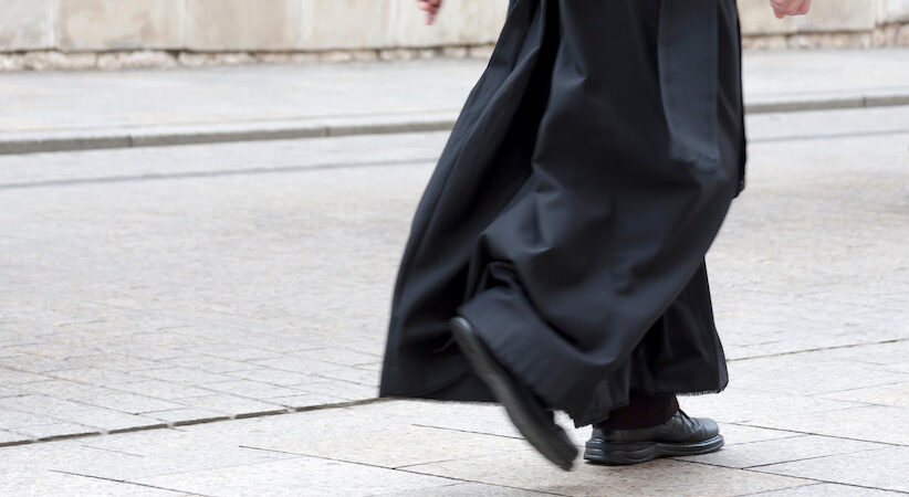 priest walking