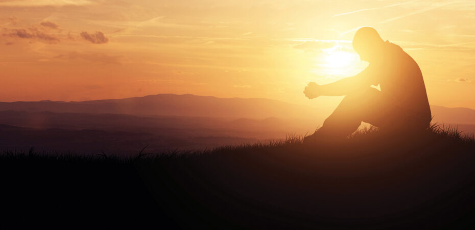 man prays